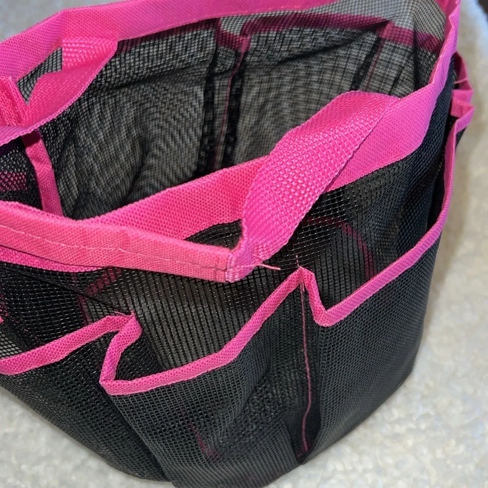 Mesh shower tote bag with 7 side pockets.
